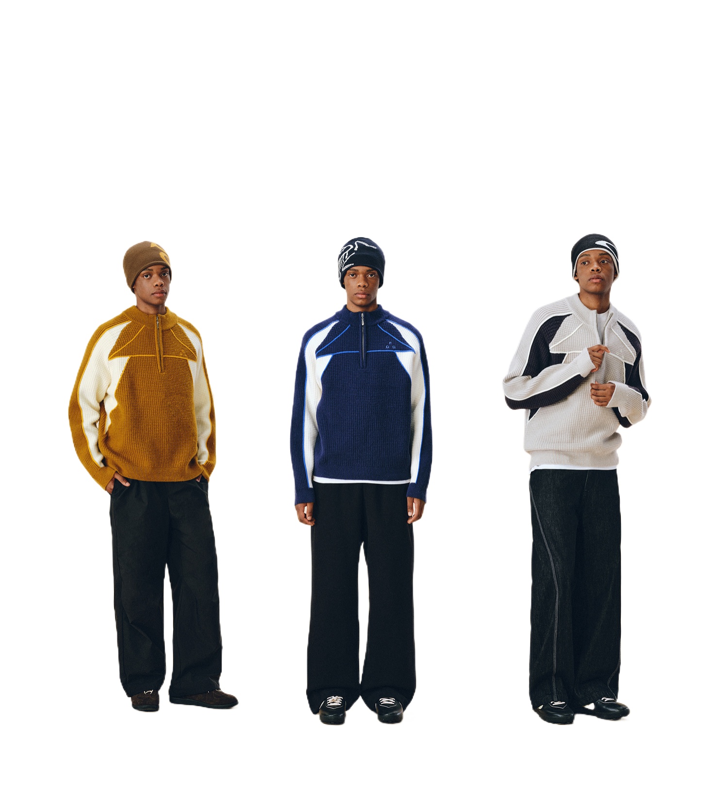 Three people stand side by side in EastLyst Color Block Half Zip Sweaters and wide-leg black pants. Their beanies and the sweaters' geometric color patterns in yellow, blue, or gray pop against the clean white background.